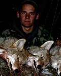 The author with his four bow-killed coyotes.