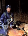Titus with his first archery buck, Ricky.